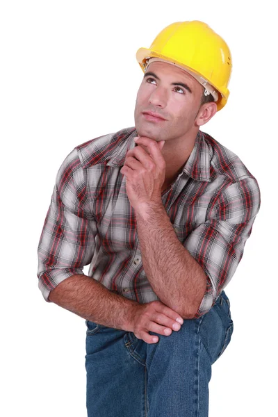 Tradesman with a dreamy look on his face Royalty Free Stock Images