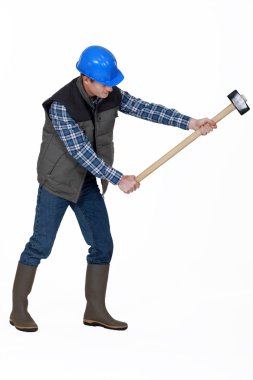 Man using sledge-hammer clipart