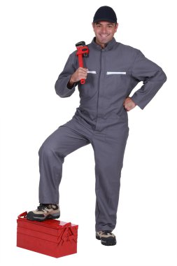 Man with a wrench and toolbox clipart