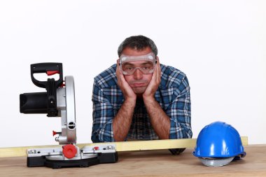 A fed-up and bored tradesman clipart