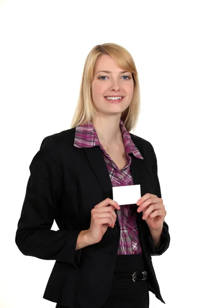 Blond woman holding business card — Stock Photo, Image