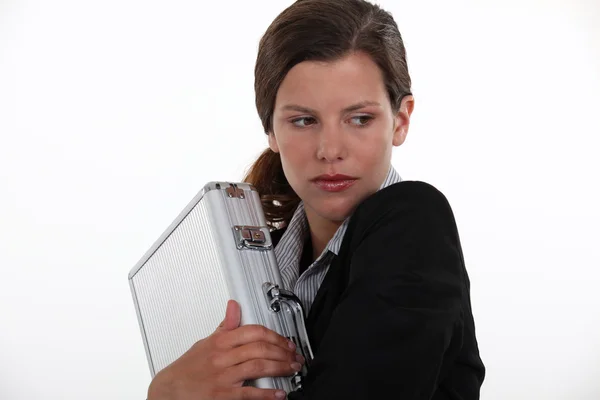 Businesswoman protecting briefcase — Stock Photo, Image