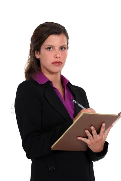 Uma mulher de negócios a tomar notas . — Fotografia de Stock