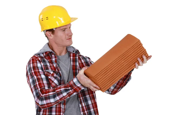 Roofer holding pile of tiles — Stock Photo, Image