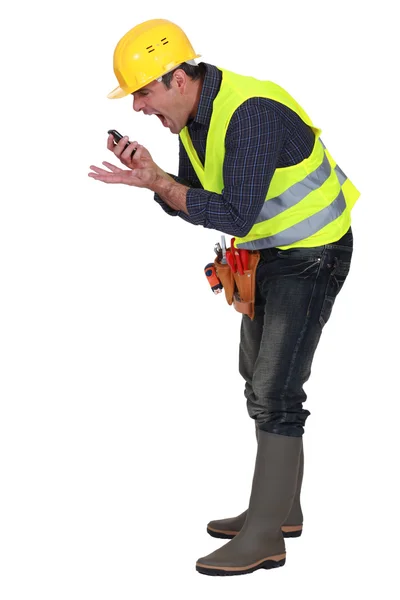 Foreman gritando em um telefone celular — Fotografia de Stock
