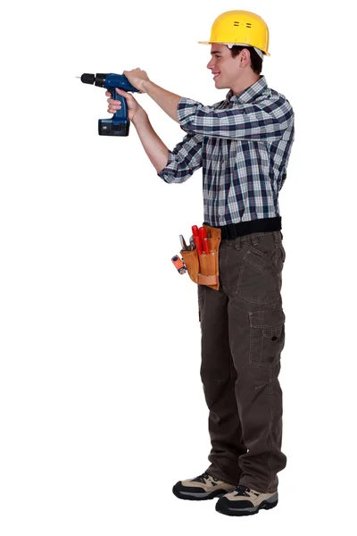 Young craftsman working with a drill — Stock Photo, Image