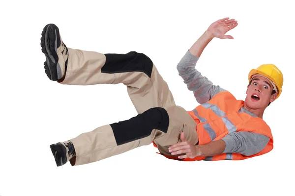 Construction worker falling over — Stock Photo, Image