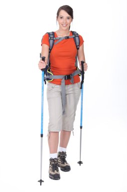 Woman preparing to go hiking clipart