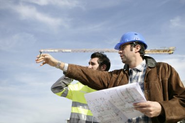 Foreman and worker on a site clipart