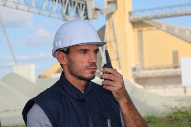 Construction worker with a walkie talkie clipart