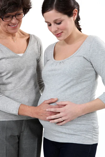 Mother taking care of her pregnant daughter — Stock Photo, Image