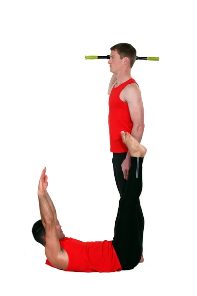 Gimnastycy, tworzące literę j — Zdjęcie stockowe