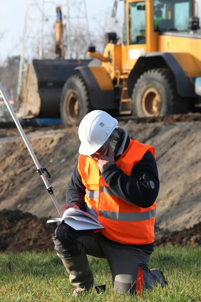 Site surveyor taking readings — Stock Photo, Image