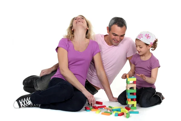 Familia jugando con bloques de construcción Fotos de stock