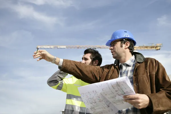 Foreman and worker on a site Stock Picture