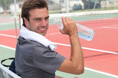 Tennis player drinking water clipart