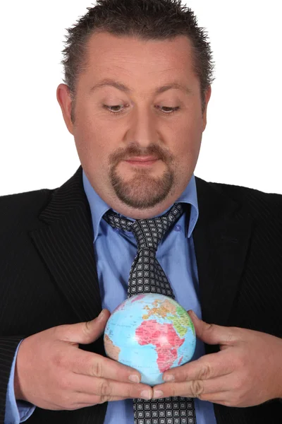 Mann mit Globus — Stockfoto