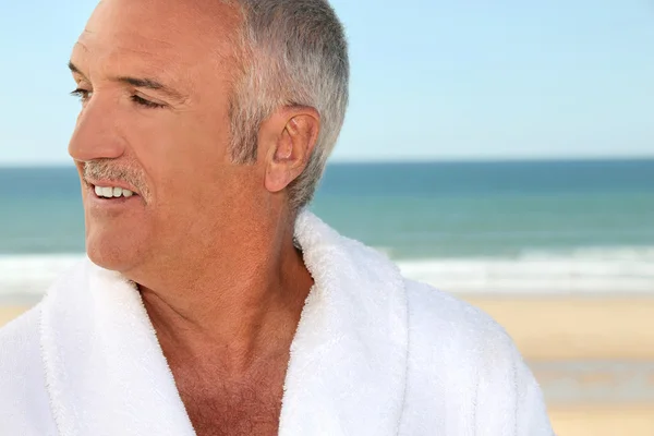 Senior man in a bathrobe — Stock Photo, Image