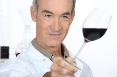 Man tasting red wine clipart