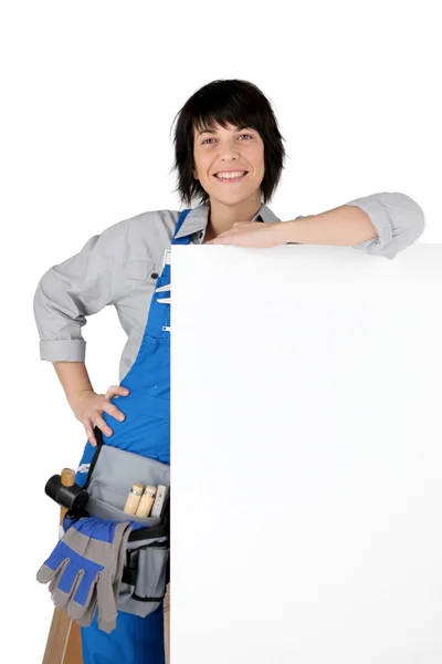 Female DIY person stood with blank poster — Stock Photo, Image