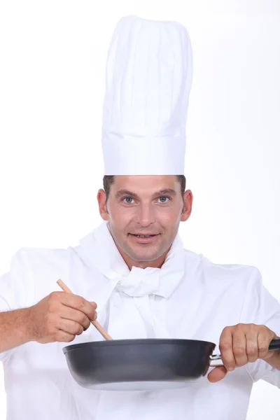 Chef stirring pan — Stock Photo, Image
