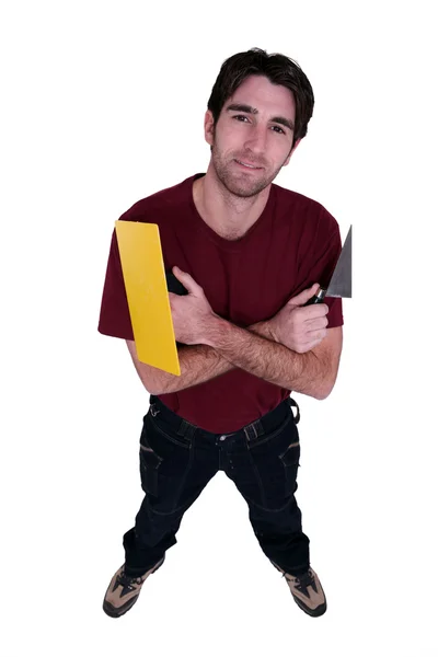 Mann mit Messer und Fugenmörtel — Stockfoto