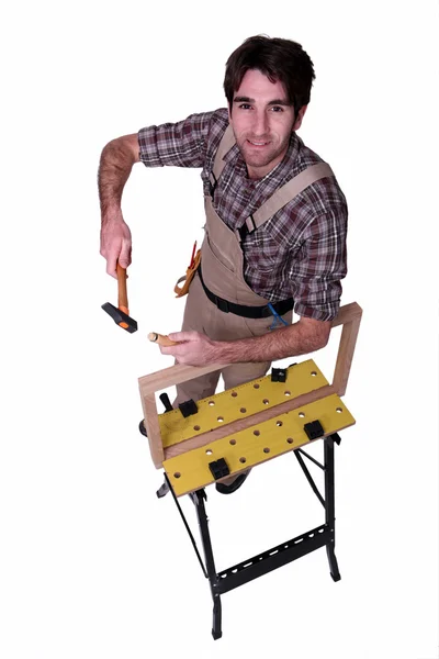 Carpenter with a workbench — Stock Photo, Image