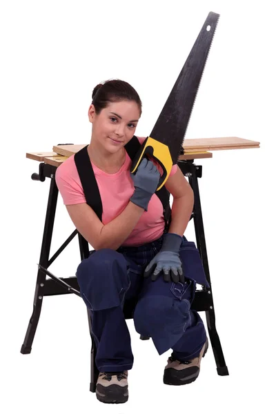 Woman with hand-saw — Stock Photo, Image