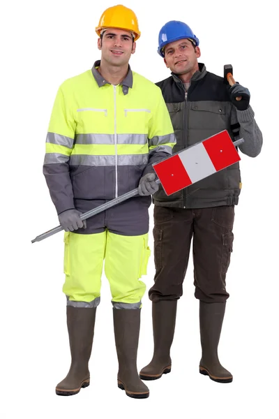 Full-length portrait of bricklayer and carpenter — Stock Photo, Image