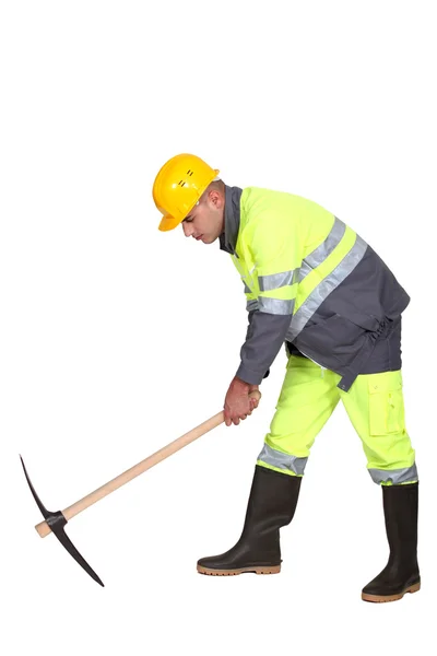 Road-worker with pick-axe — Stock Photo, Image