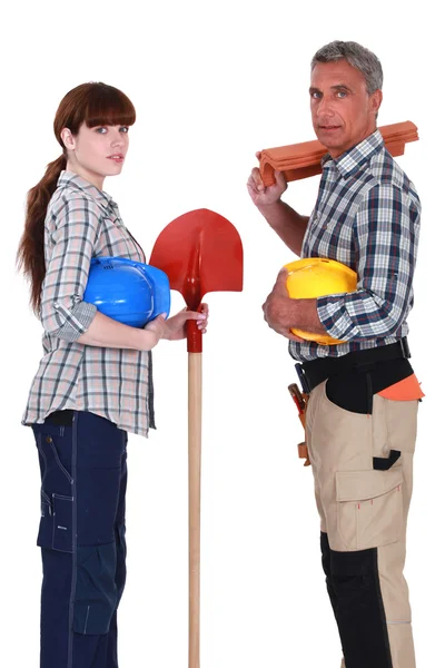 Male and female roofers stood together — Stock Photo, Image