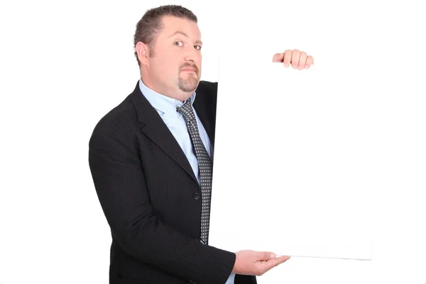Kluger Mann schaut skeptisch mit weißem Panel — Stockfoto