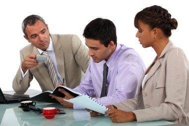 Three having a business meeting clipart