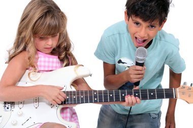 Children singing and playing music clipart
