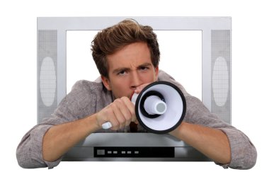 Man with megaphone coming through television clipart