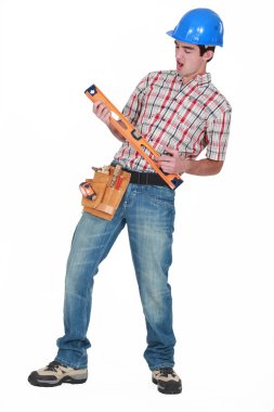 Construction worker playing air guitar clipart