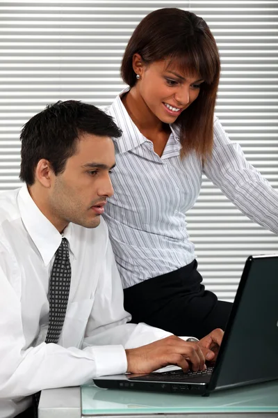 Man and woman sitting with computer — Stock Photo, Image