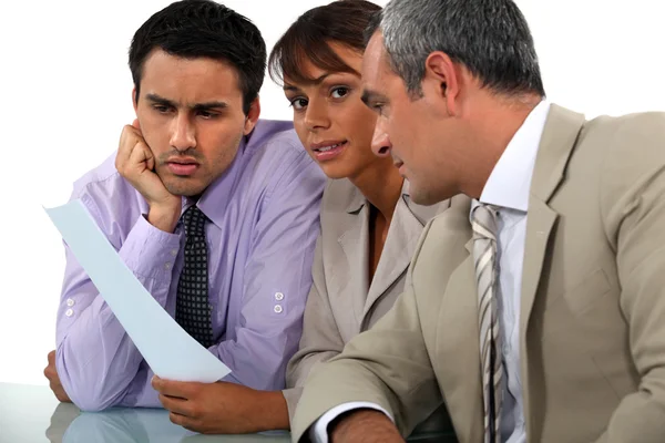 Three professionals in meeting — Stock Photo, Image
