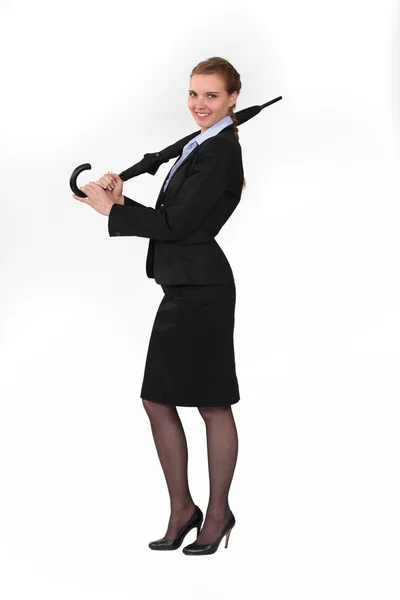 Smart woman in suit with umbrella — Stock Photo, Image