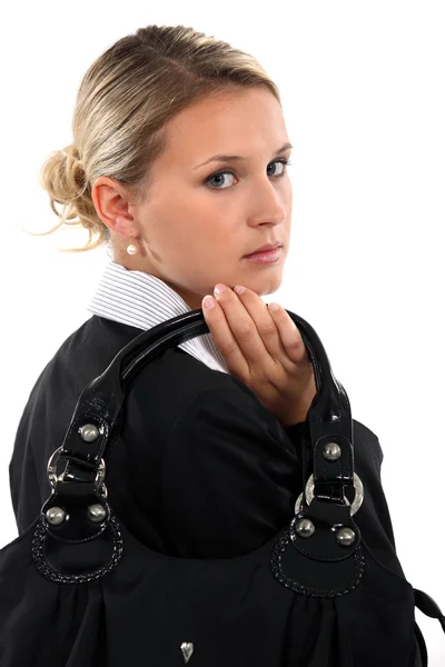 Blond businesswoman holding handbag — Stock Photo, Image