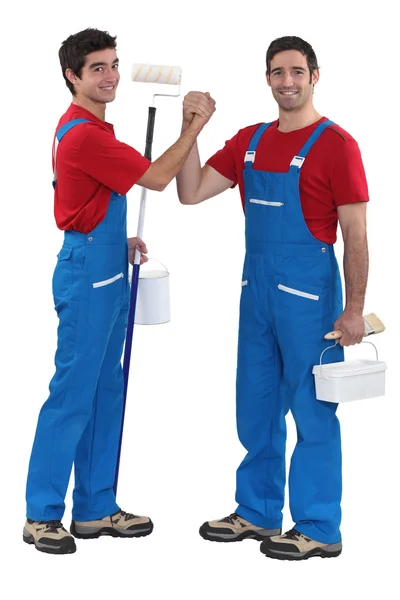 Craftsman painter and his apprentice shaking hands — Stock Photo, Image