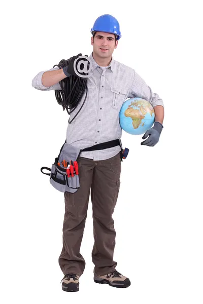 Elettricista in piedi tenendo globo — Foto Stock