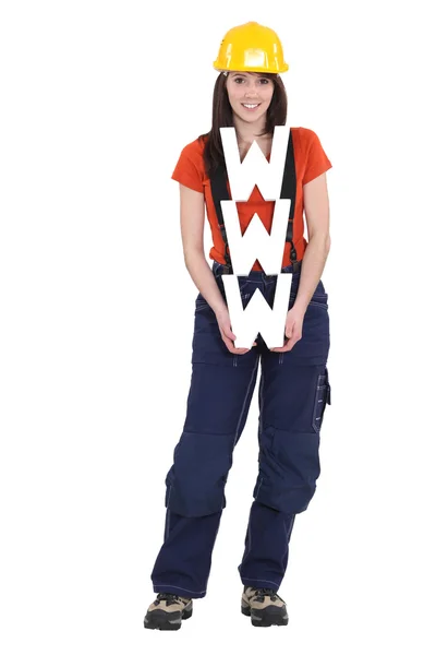 一名女性建筑工人举行 www 标志. — 图库照片