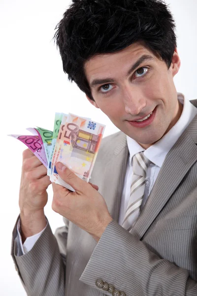 Banker holding bank notes — Stock Photo, Image