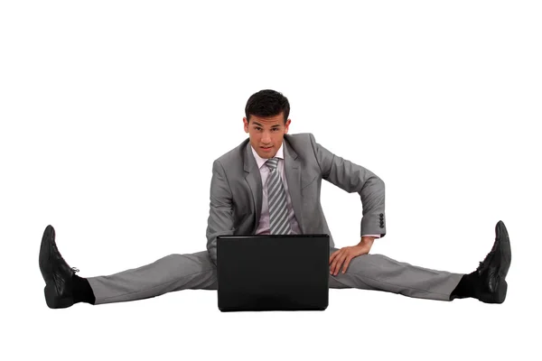 Businessman side splitting on the floor — Stock Photo, Image
