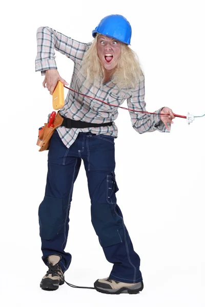 Female electrician receiving shock — Stock Photo, Image