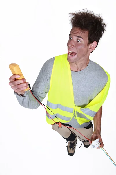 Electrician in a state of shock — Stock Photo, Image