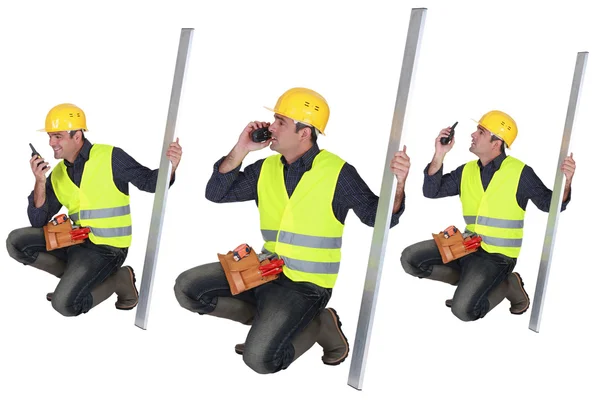 Construction worker with a walkie talkie — Stock Photo, Image
