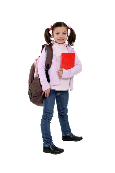 Flicka med ryggsäck och mapp — Stockfoto