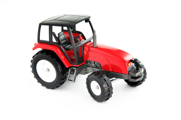 Красный игрушечный трактор — стоковое фото